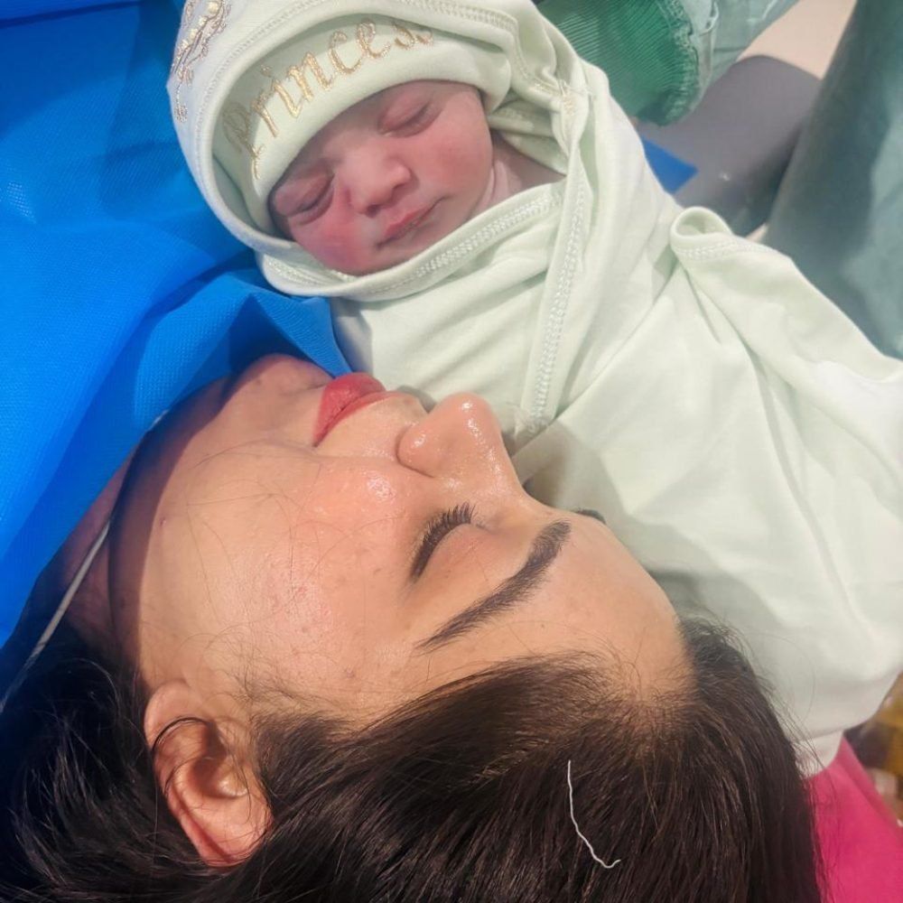 A mother holding her newborn baby at GynaeCare clinic